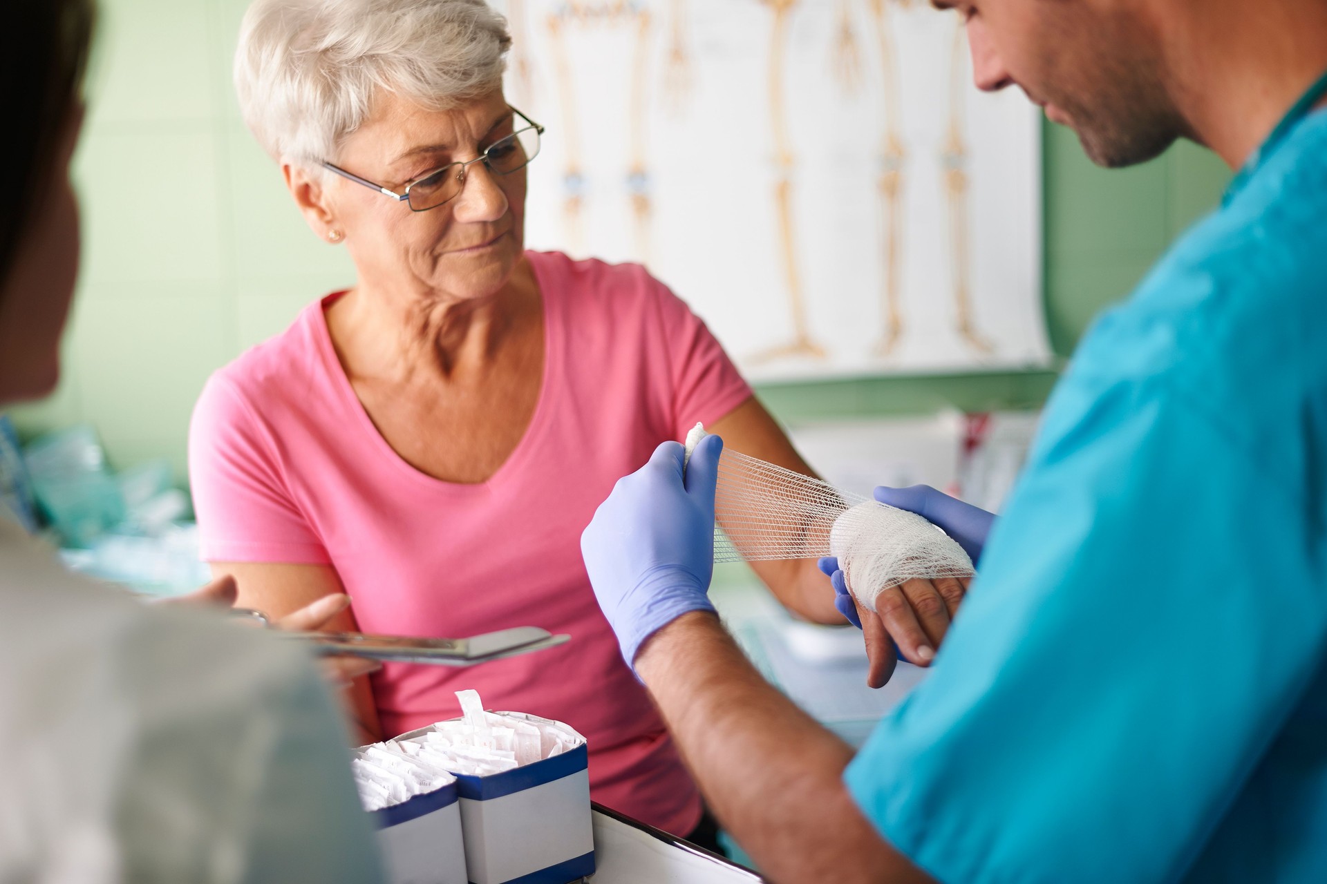 Senior woman with bandage on the hand